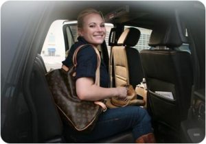 Spoiled rich socialite Meghan McCain being chauffeured around, Louis Vuitton bag in tow